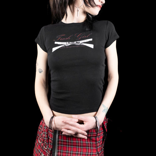 Person wearing a black t-shirt with 'Trash Girl' design on a black background
